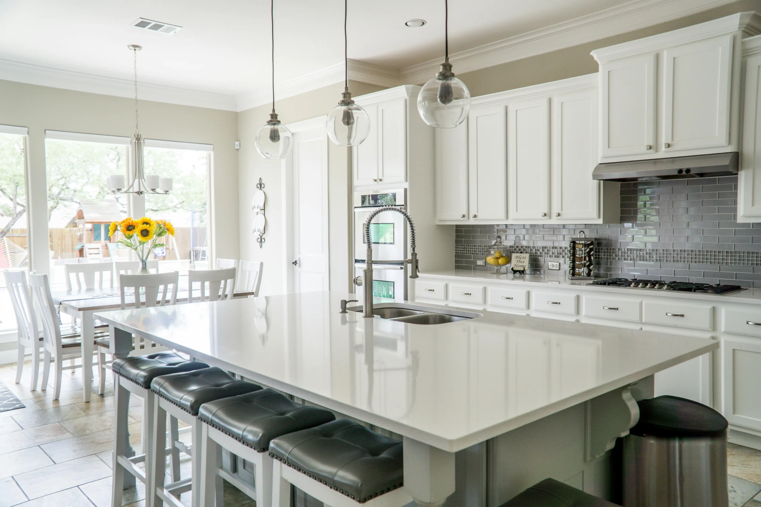 A white kitchen completed with cabinet painting services