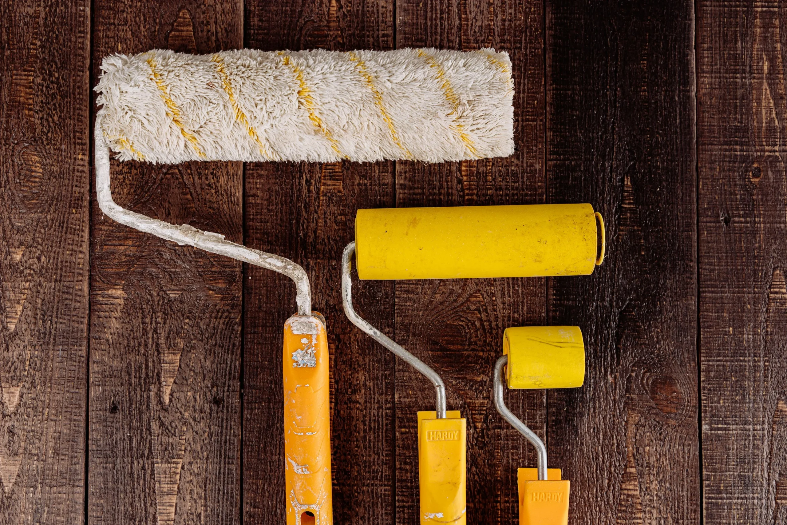 Three differently sized paint rollers for interior painting services in Austin