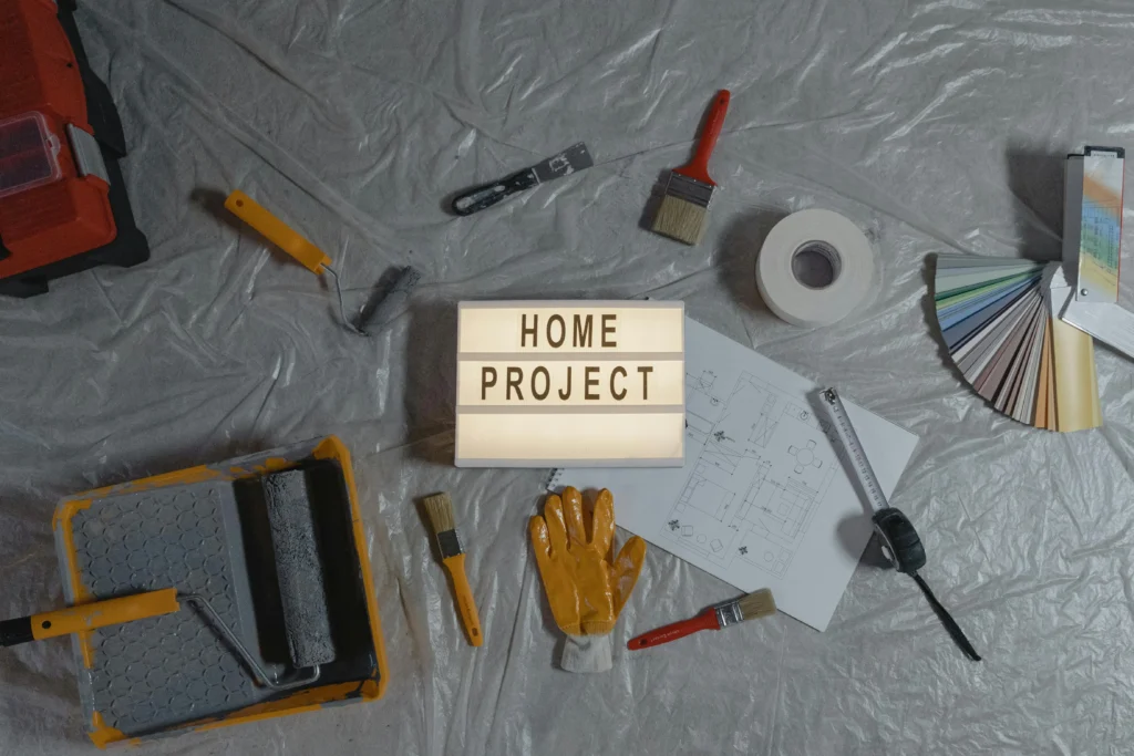 a sign saying Home Project surrounded by home improvement tools