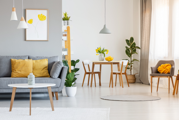 A living room and dining area painted gray and white 