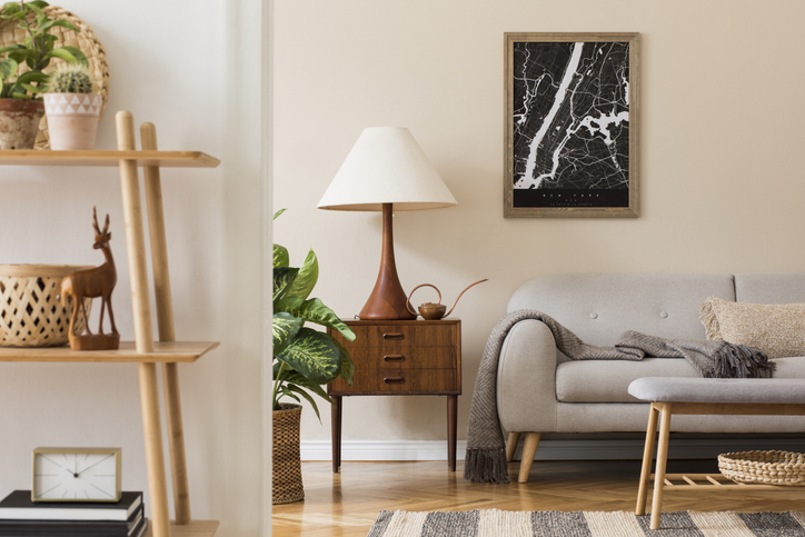 The interior paint of a living room area with a gray couch